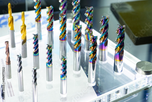 CNC cutters for metal. Multi-colored drills close-up. Accessories for engraving, milling, cutting of various metals. Cutters of different types. Monolithic milling tool. Solid carbide milling cutters photo
