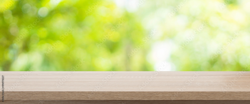 Empty wooden table with garden bokeh for a catering or food background with a country outdoor theme,Template mock up for display of product Empty wooden table with garden bokeh for a catering or food background with a country outdoor theme,Template mock up for display of product