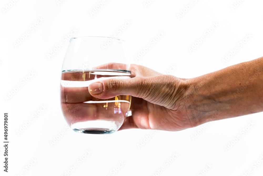 hand offering glass with pure water, white background hand offering glass with pure water, white background