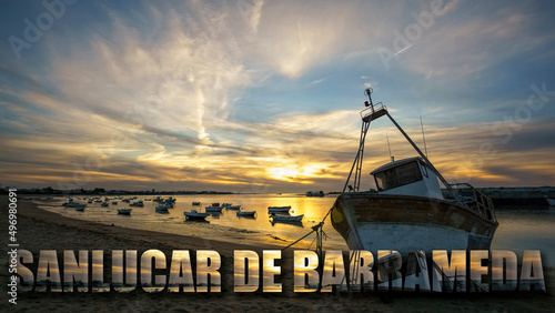 Boats On Guadalquivir River Sanlucar De Barrameda text Cadiz Spain photo
