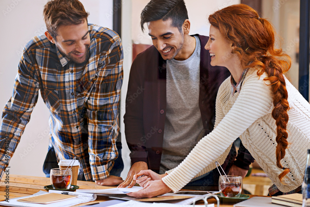 Fototapeta premium Creative discussions. Shot of a team of young designers working together in their office.