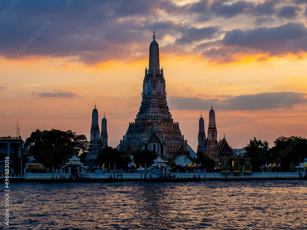 Wat Arun has a beautiful sky with clouds in the background. and evening light located in Bangkok, Thailand
