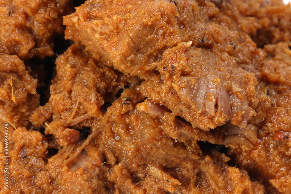 Traditional cooked beef meat rendang dry curry closeup Traditional cooked beef meat rendang dry curry closeup