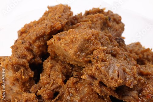 Traditional cooked beef meat rendang dry curry closeup