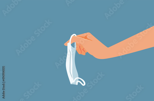 Hand Holding a Medical Mask Vector Cartoon Illustration 