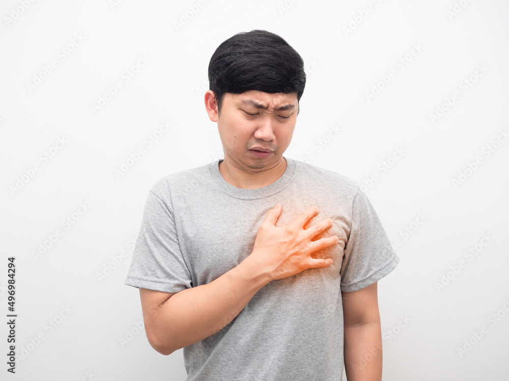 Asian man grey shirt gesture pain heart white background Asian man grey shirt gesture pain heart white background
