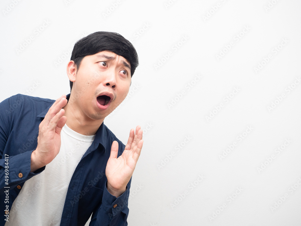 Asian man gesture excited looking at coy space white background Asian man gesture excited looking at coy space white background