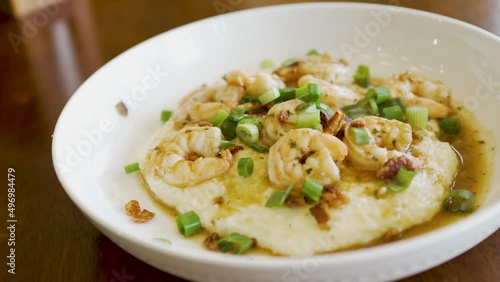 Wallpaper Mural Steaming delicious plate of homemade shrimp and grits in a bowl ready to eat - dynamic isolated motion Torontodigital.ca