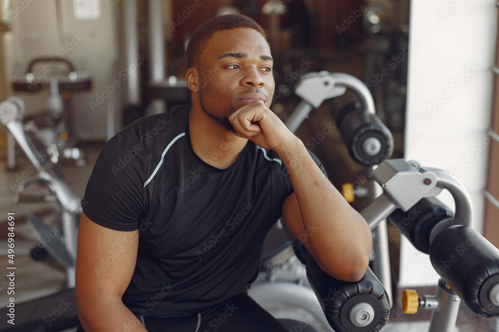 A handsome black man is engaged in a gym A handsome black man is engaged in a gym