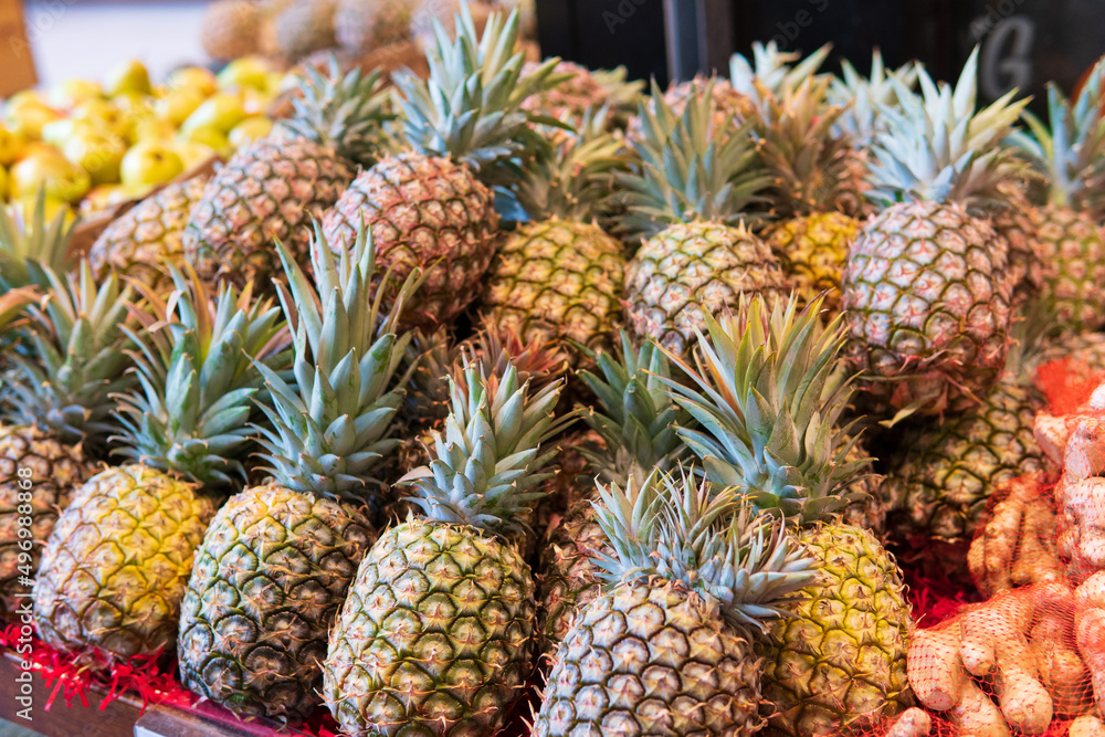 Fresh tropical fruit pineapples on the market
