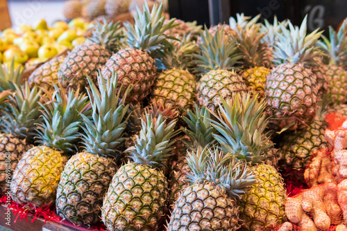 Fresh tropical fruit pineapples on the market