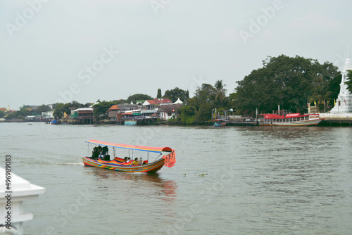 Tourists on a longtail boat visit Koh Kret. The Thai tourist attraction is famous of the Nonthaburi, Thailand.