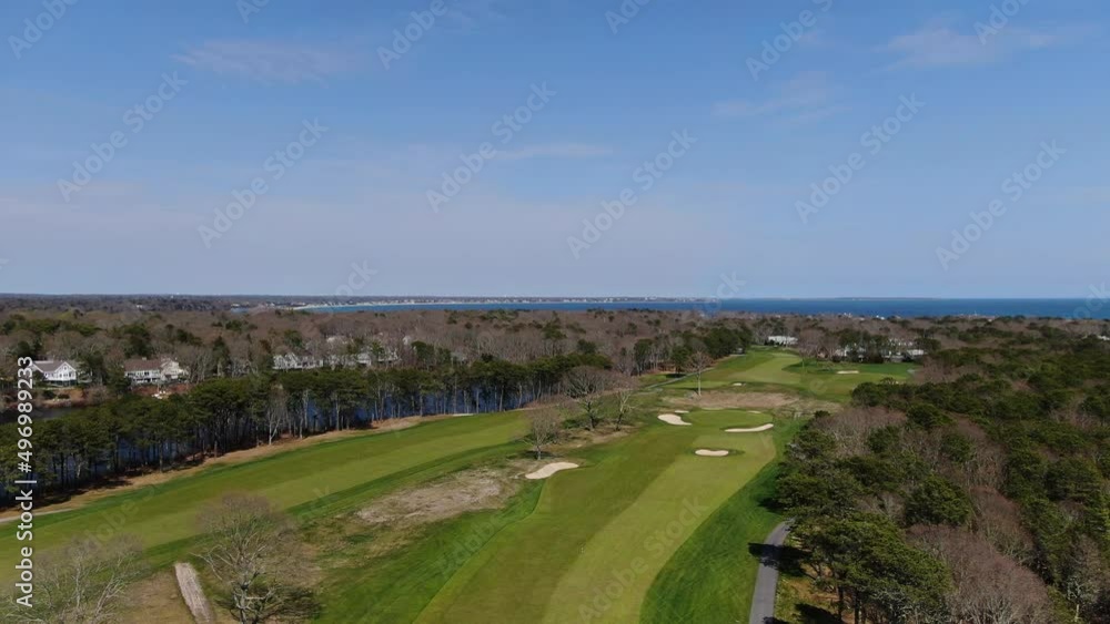 Luxury green and vibrant golf field of Osterville, MA. Aerial descend view Luxury green and vibrant golf field of Osterville, MA. Aerial descend view