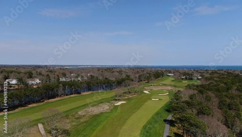 Luxury green and vibrant golf field of Osterville, MA. Aerial descend view photo