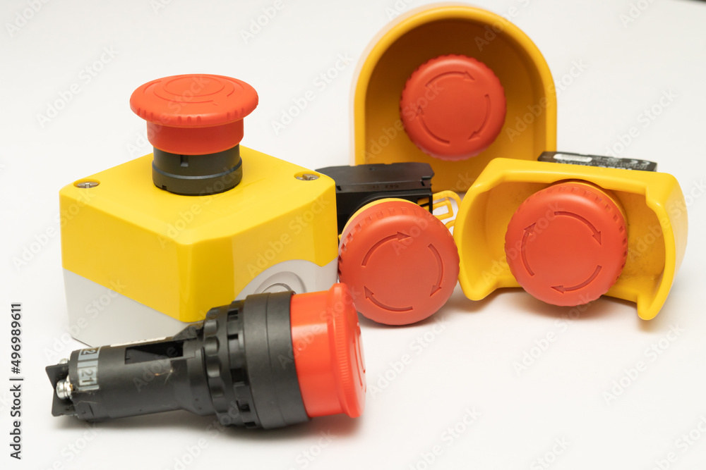 Stop Red Button and the Hand of Worker About to Press it. emergency stop button. Big Red emergency button or stop button for manual pressing. Stop Red Button and the Hand of Worker About to Press it. emergency stop button. Big Red emergency button or stop button for manual pressing.