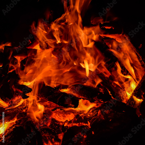 Fire flames on black background, Blaze fire flame texture background, Beautifully, the fire is burning, Fire flames with wood and cow dung bonfire