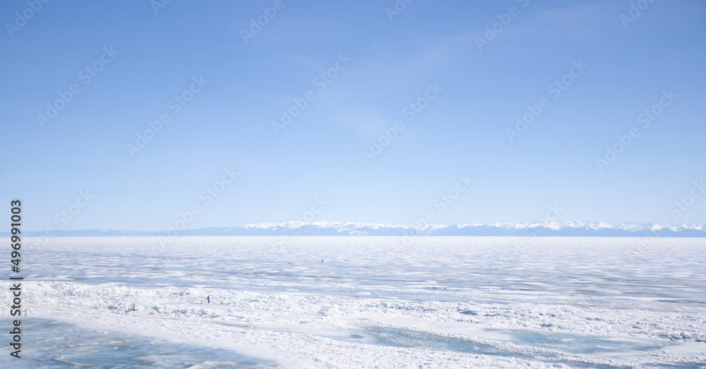 Lake Baikal. Winter. Village Listvyanka. Blue sky. Ice. Lake Baikal. Winter. Village Listvyanka. Blue sky. Ice.