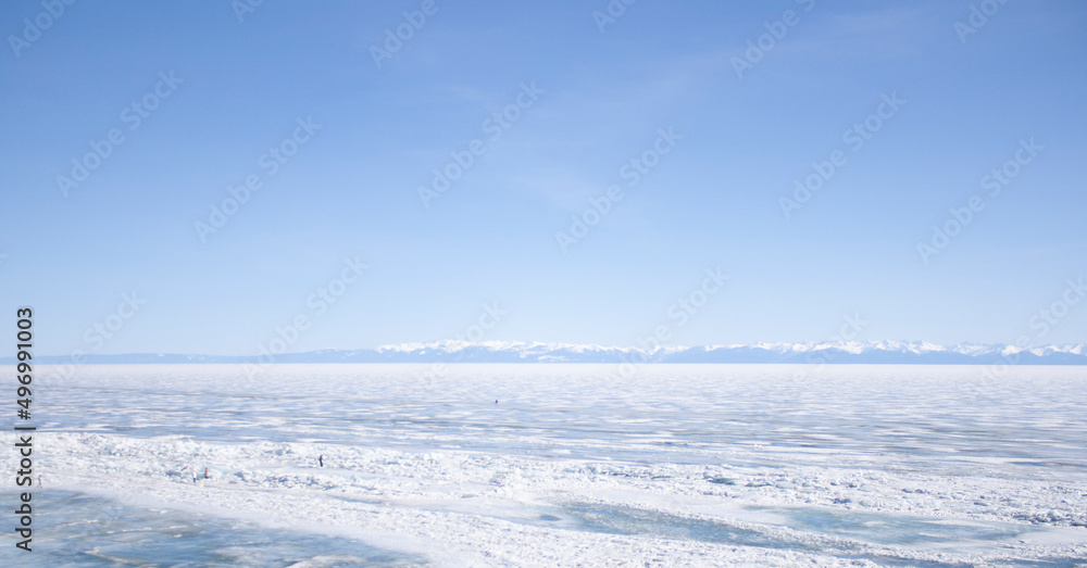 Lake Baikal. Winter. Village Listvyanka. Blue sky. Ice.