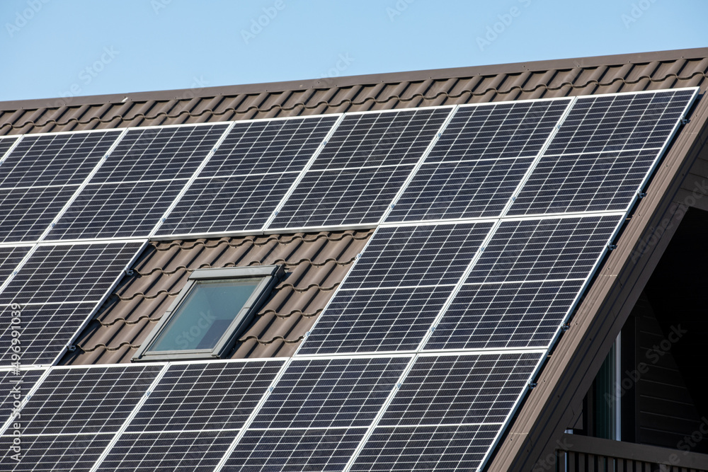 Solar panels on brown metal roof. Environmentally and energy saving Solar panels on brown metal roof. Environmentally and energy saving
