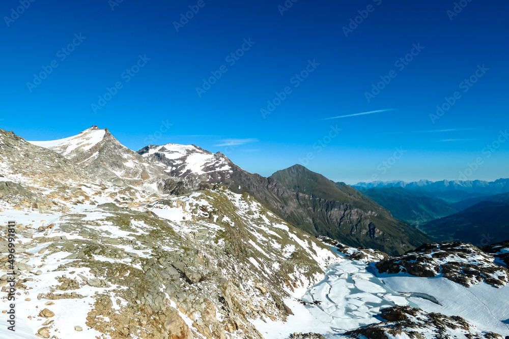 Obraz premium Panoramic view on the mountains of High Tauern Alps in Carinthia and Salzburg, Austria, Europe. Glacier lakes of the Goldbergkees in the Hohe Tauern National Park. Patagonia like landscape. Snow