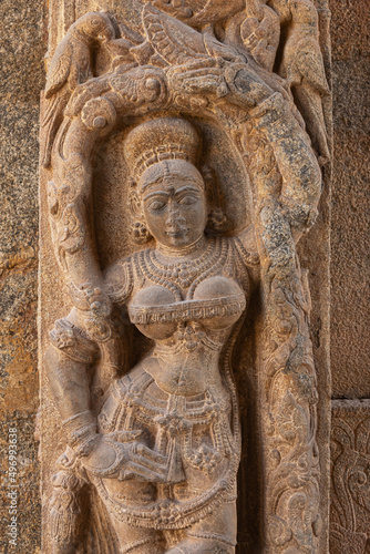 Carved scuplture of woman on entrance gate of Someshwara Temple, Kolar, Karnataka, India photo