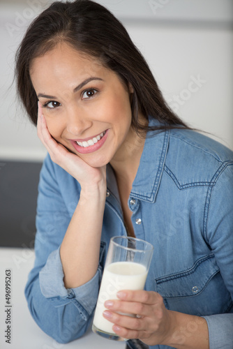 beautiful woman holding a healthy glass of milk