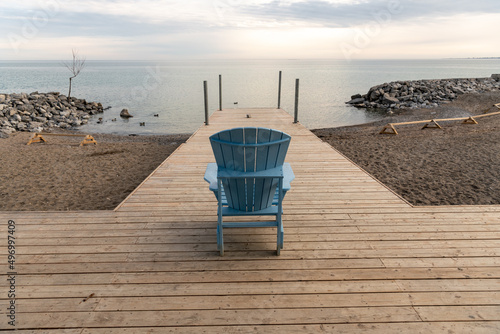 Looking out to the horizon from a simple wooden dock.  Shot in Toronto's iconic Beaches neighbourhood in early spring.   photo