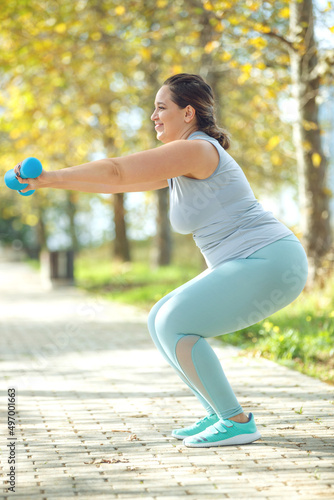 Fat woman doing sports. High quality photo