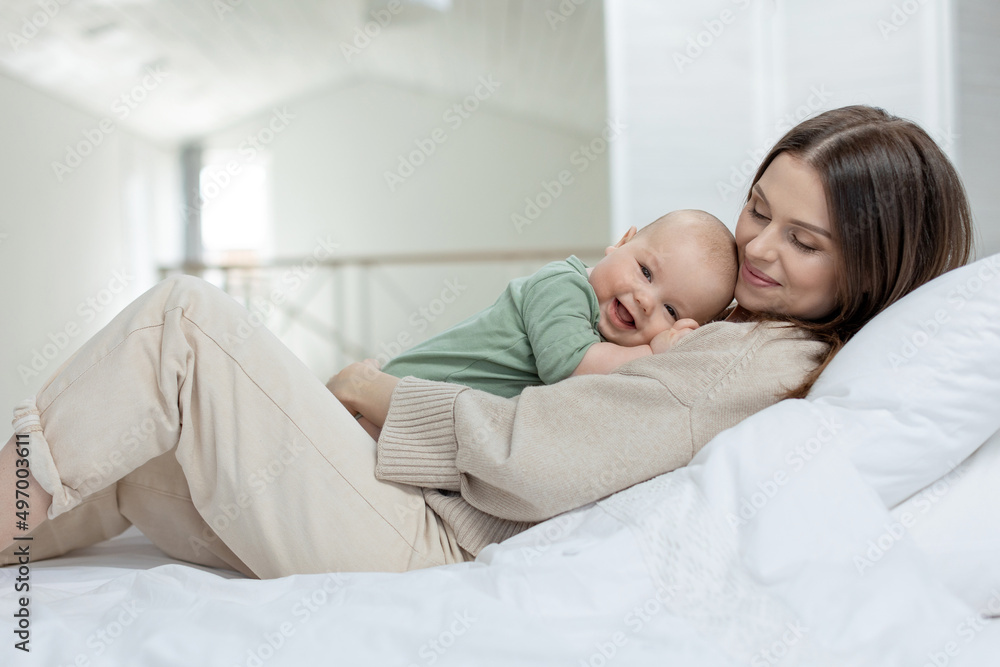 A woman with a small child. Mom with a baby. High quality photo A woman with a small child. Mom with a baby. High quality photo
