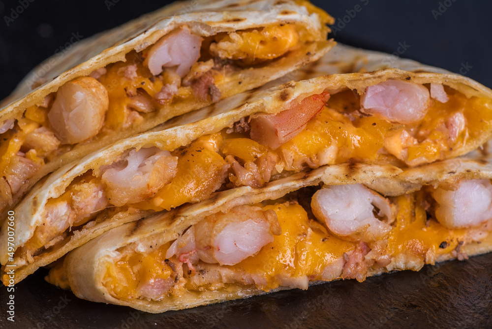 Quesadilla with shrimp. Tortilla, shrimp, cheese, ranch sauce, herbs. Quesadilla with shrimp. Tortilla, shrimp, cheese, ranch sauce, herbs.