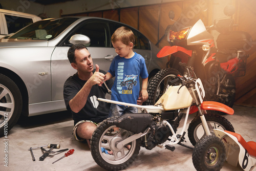 Принти на полотні Being a role model to his little boy