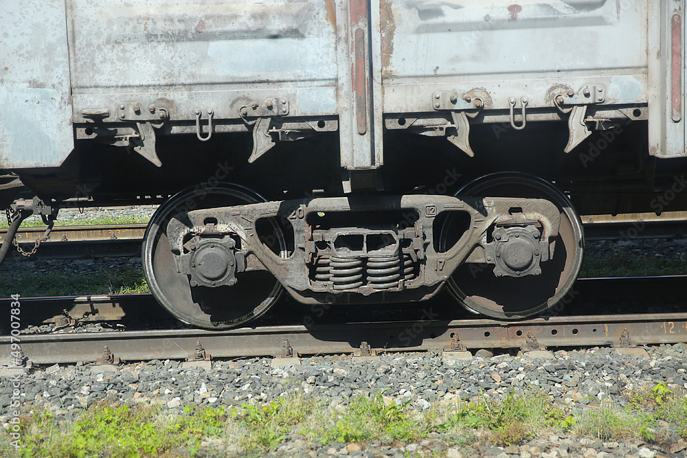 view from the train window of the freight train carriage, wheels and railway view from the train window of the freight train carriage, wheels and railway