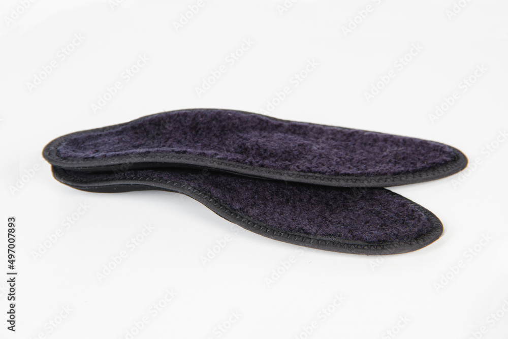 Black Insoles isolated on a white background. Medical orthopedic insoles. Foot care. Insole cutaway layers. Treatment and prevention of flat feet and foot diseases. Inner soles of shoes Black Insoles isolated on a white background. Medical orthopedic insoles. Foot care. Insole cutaway layers. Treatment and prevention of flat feet and foot diseases. Inner soles of shoes