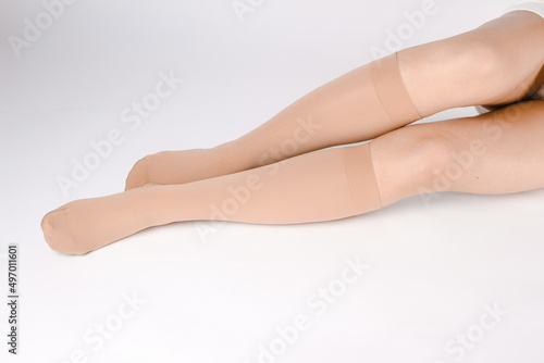 Medical Compression Stockings for varicose veins and venouse therapy. Compression Hosiery. Sock for sports isolated on white background. Black color socks mock up for advertising, branding, design