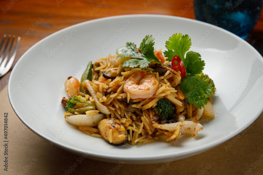 seafood dishes on a wooden table
