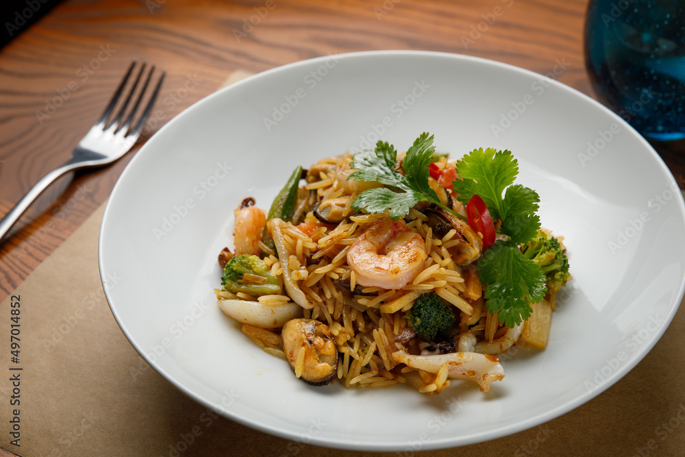 seafood dishes on a wooden table
seafood dishes on a wooden table