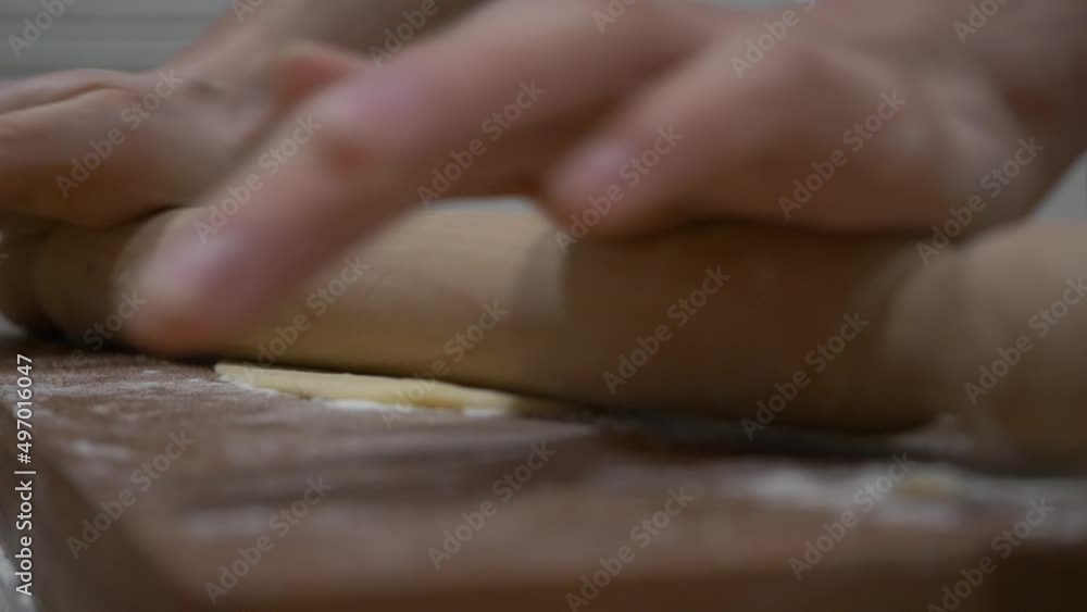 Rolling all purpose flour dough to make Faworki polish dish Rolling all purpose flour dough to make Faworki polish dish