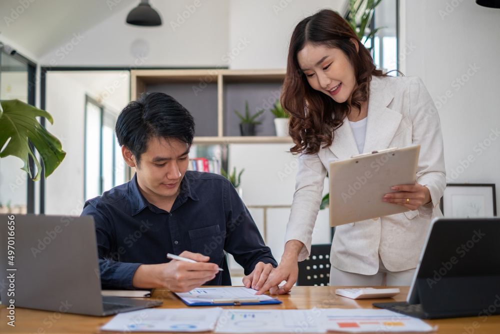 Group of Asian Business people discuss and brainstorming to analyze and plan about new financial project. Group of Asian Business people discuss and brainstorming to analyze and plan about new financial project.