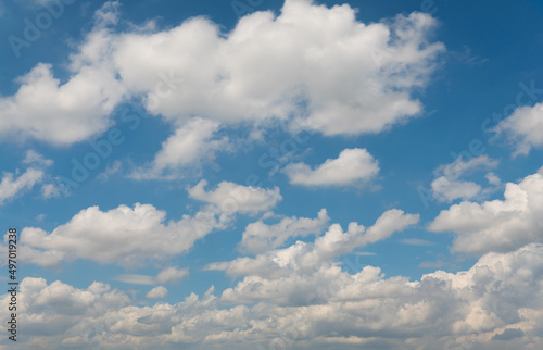 Cloudscape on blue sky background photo