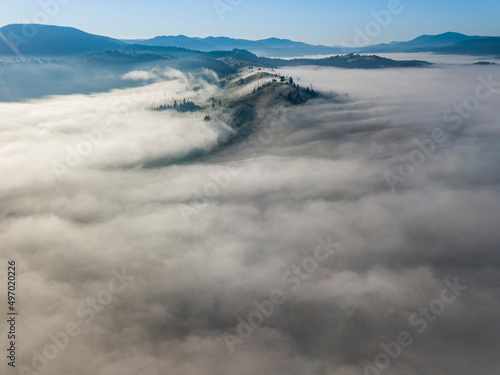 Morning fog in the Ukrainian Carpathians. Aerial drone view.