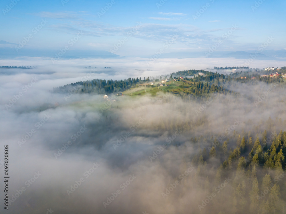 Morning fog in the Ukrainian Carpathians. Aerial drone view.