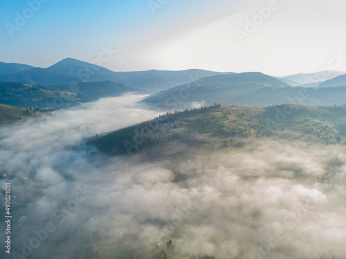 Morning fog in the Ukrainian Carpathians. Aerial drone view.