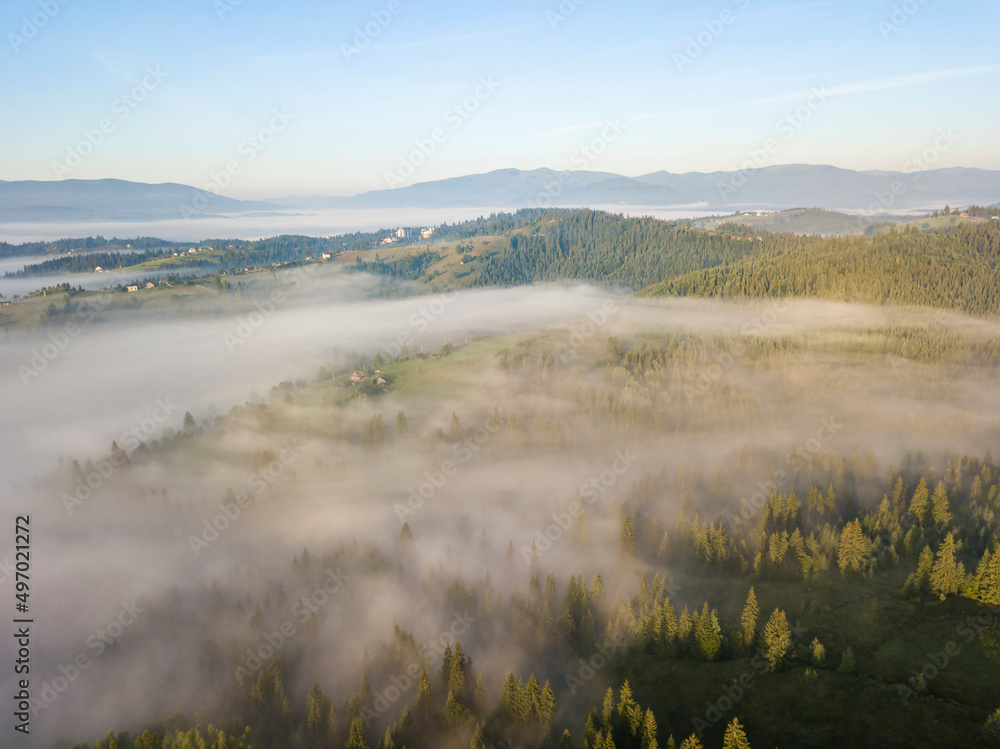 Morning fog in the Ukrainian Carpathians. Aerial drone view. Morning fog in the Ukrainian Carpathians. Aerial drone view.