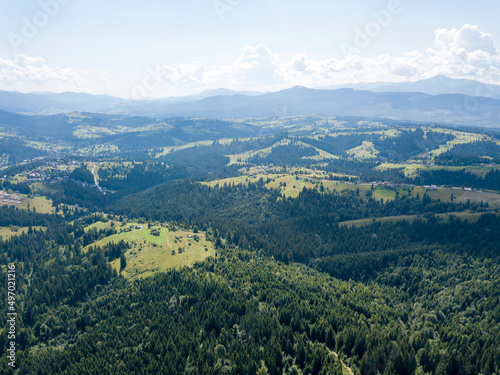 Fototapeta Naklejka Na Ścianę i Meble -  Green mountains of Ukrainian Carpathians in summer. Sunny day. Aerial drone view.