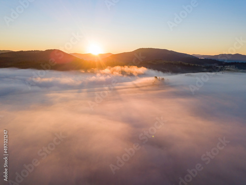 Sunrise over the fog in the Ukrainian Carpathians. Aerial drone view. © Sergey
