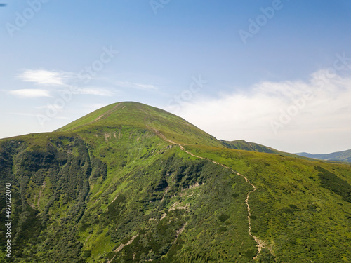 High mountains of the Ukrainian Carpathians in cloudy weather. Aerial drone view.