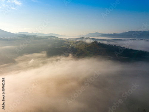 Morning fog in the Ukrainian Carpathians. Aerial drone view.