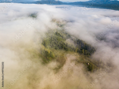 Foggy summer morning in the Ukrainian Carpathians. Aerial drone view.