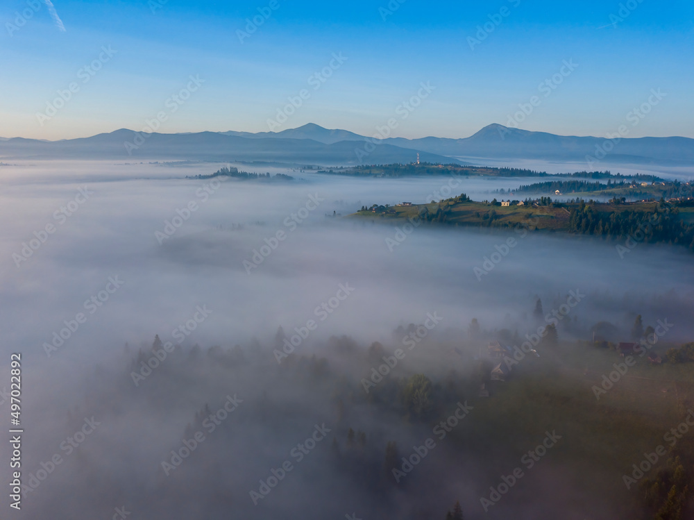 Obraz premium Morning mist in Ukrainian Carpathian mountains. Aerial drone view.