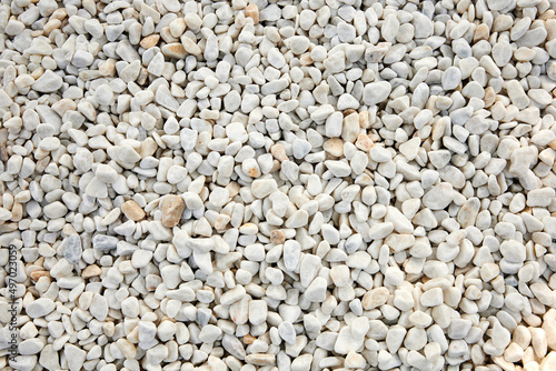 White decorative stones for arranging garden plots, white pebbles texture and background